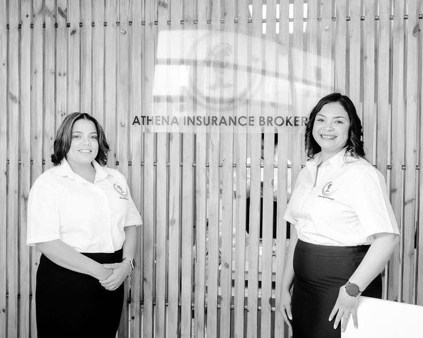 The Athena team in front of the office sign at Husab Towers